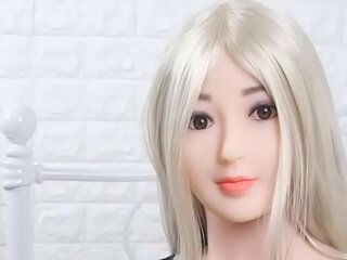Blonde Asian sex doll with her huge tits waiting to ejaculate (Big Japanese Sex Movie)